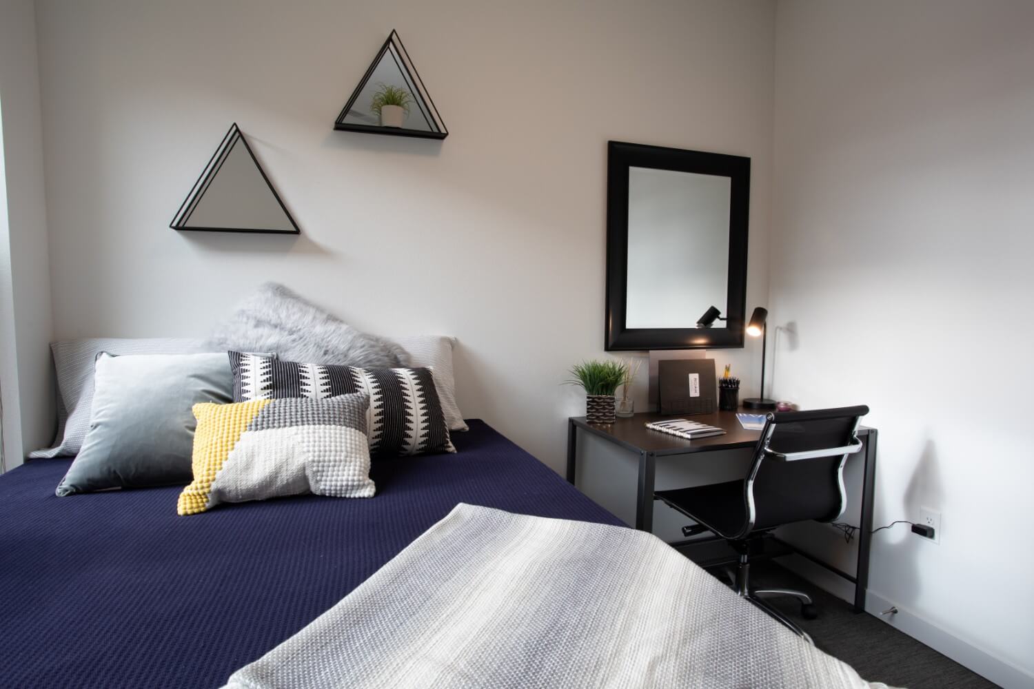 fully furnished bedroom at roam student living apartments